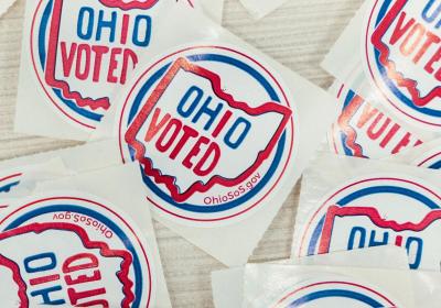 Ohio Voted stickers laid out at a polling location.