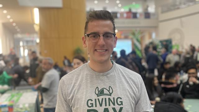 Mac Lewis was a Young Alumni Association volunteer on the day, who helped hand out prizes to participants as they entered the atrium.