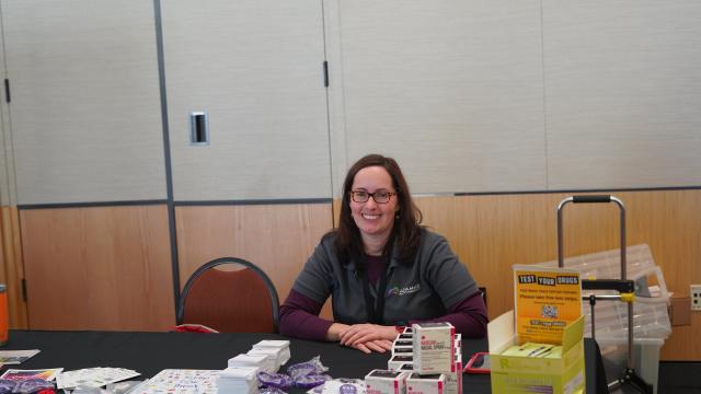 Michaele Smith from ADAMS at a WellFest table.