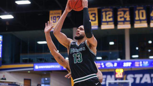 Tristan Enaruna (13)  in action against Kent State.