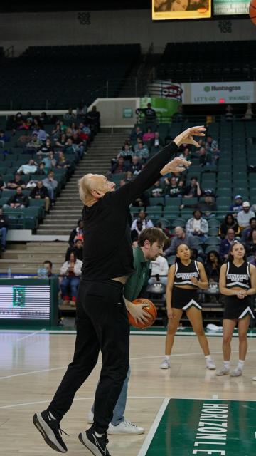 CSU College of Law Dean Lee Fisher shoots a free throw on Feb. 12, 2025.